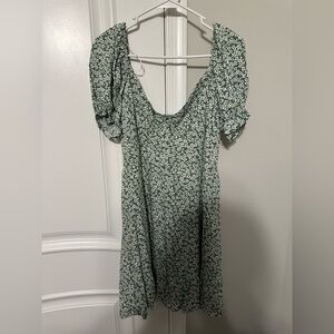 Green dress with little white flowers. Heart shaped neckline and puffy sleeves